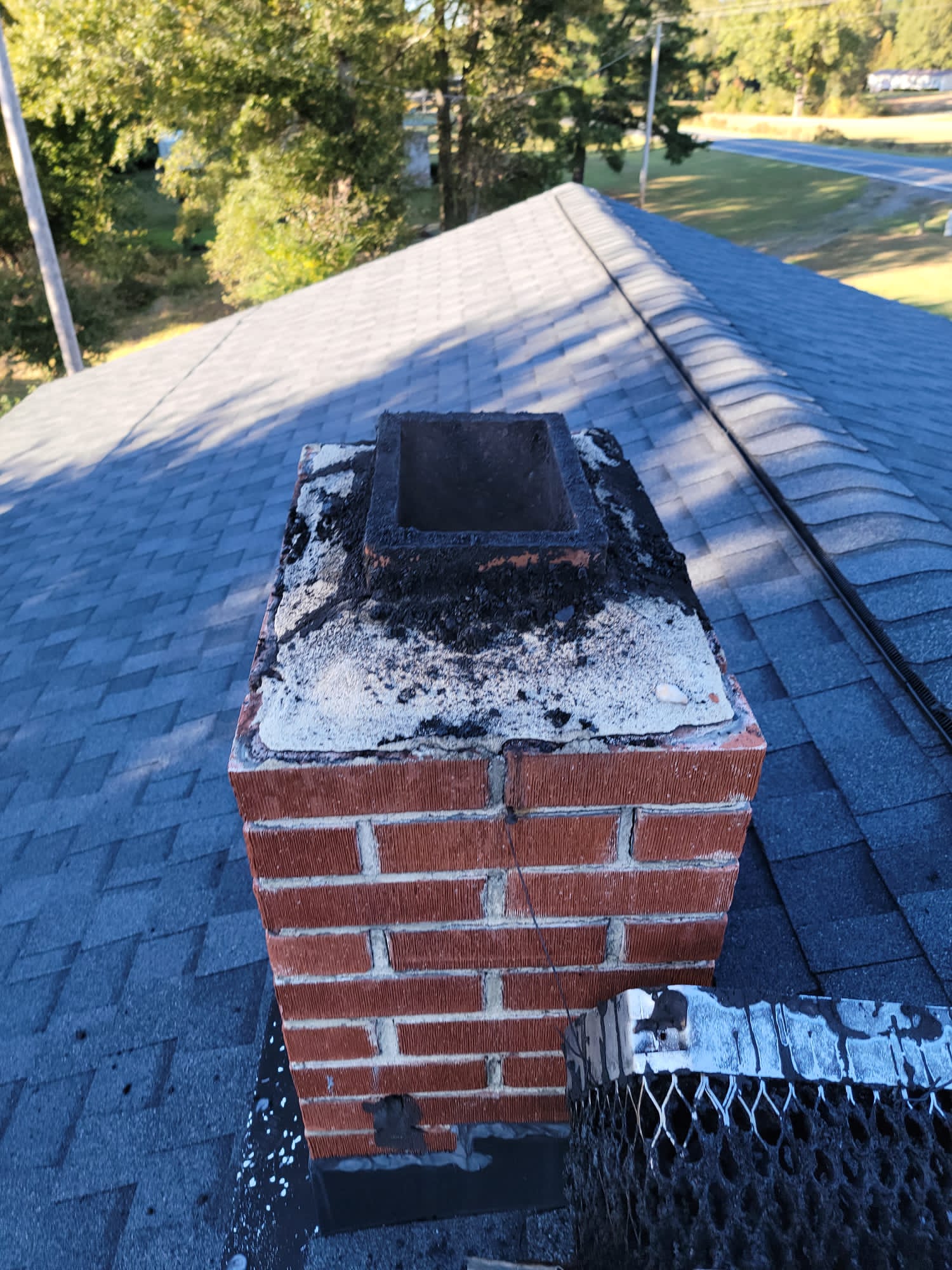 chimney sweep from roof side