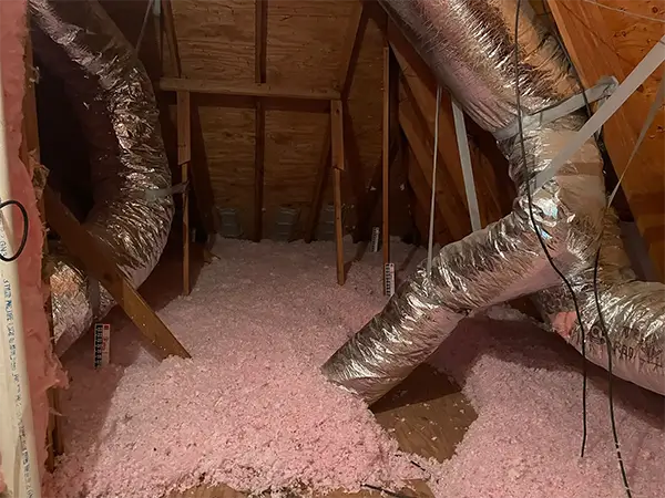 Fiber glass insulation blown in up to code