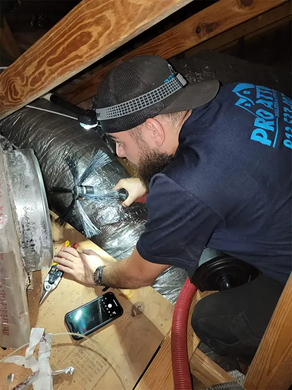 Air duct cleaning: running a roto brush that connected to Hepa filter vacuum